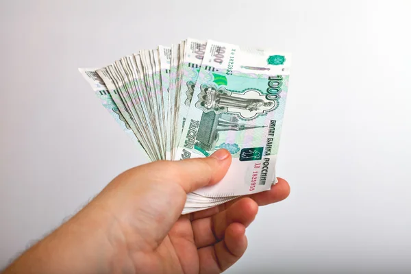 Bundle of bank notes Russia dignity thousand rubles in his hand — стоковое фото